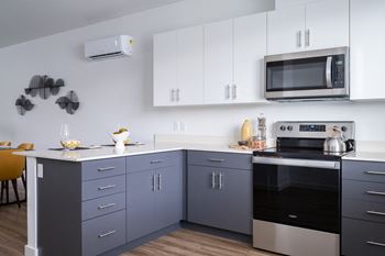 Designer kitchen cabinets with white uppers