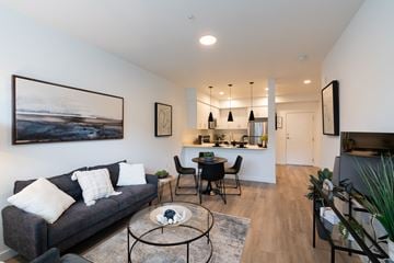 Oregon City townhouse for rent - A living room with a grey couch and a coffee table.