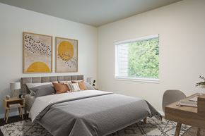 Vancouver apartment for rent - A bedroom with a large bed and two framed pictures on the wall.