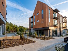 Charlottesville apartment for rent - a view of a building with a pool in front of it
