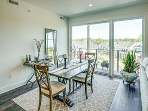 Charlottesville apartment for rent - a dining room with a table and chairs and large windows