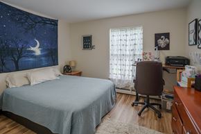 Littleton apartment for rent - a bedroom with a bed and a desk with a chair