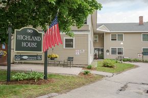 Whitefield apartment for rent - a sign for the highland house with an flag in front of it