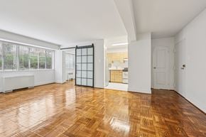 Washington apartment for rent - A room with wooden flooring and white walls.