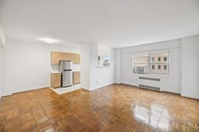 Washington apartment for rent - A room with wooden flooring and white walls.