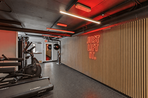 Washington apartment for rent - A gym with a rowing machine and a sign that says