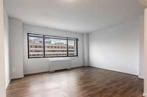 Washington apartment for rent - A room with a window overlooking a building.