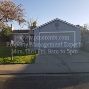 Modesto apartment for rent - A garage with a sign that reads "www.preneurs.com Property Management Experts Mon. thru Fri. 9am to 5pm".