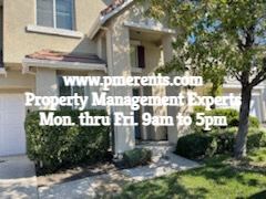 Stockton apartment for rent - A house with a sign that says www.pmerenis.com Property Management Experts Mon thru Fri 9am to 5pm.
