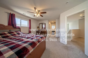 Stockton apartment for rent - a bedroom with a bed and a ceiling fan