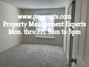 Stockton apartment for rent - A room with a door and a sign that says www.pmoments.com Property Management Experts Mon. thru Fri. 9am to 5pm.