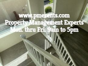 Stockton apartment for rent - A staircase in a house with a website address for property management experts.
