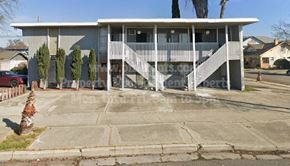 Stockton apartment for rent - a house with a porch and stairs on a street