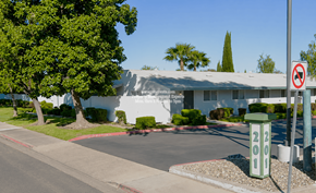 Modesto condo for rent - A white building with a no parking sign in front of it.