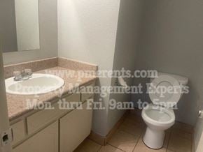Stockton triplex for rent - a bathroom with a sink and a toilet