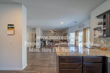 Stockton apartment for rent - A kitchen with a counter and a sign on the wall.
