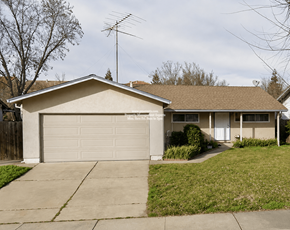 Stockton apartment for rent - A house with a garage and a driveway.