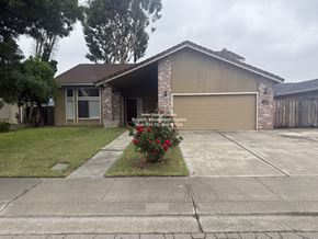 Stockton apartment for rent - A house with a garage and a driveway.