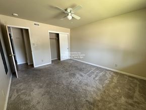 Stockton apartment for rent - A room with a ceiling fan and carpeted floor.