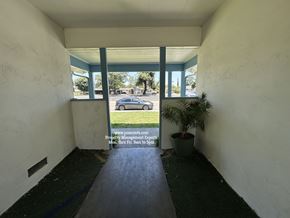 Stockton apartment for rent - A sign in the window of a building advertises property management services.