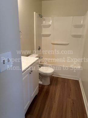 Stockton triplex for rent - a small bathroom with a toilet and a sink