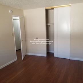 Modesto condo for rent - A room with a door and a clock on the wall.