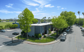 Stockton apartment for rent - A street view of a residential area with cars parked on the side of the road.