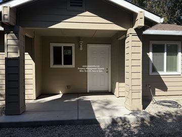 Stockton apartment for rent - A house with a white door and a window is shown.