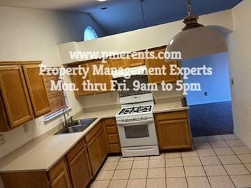 Stockton apartment for rent - a kitchen with a stove and a sink