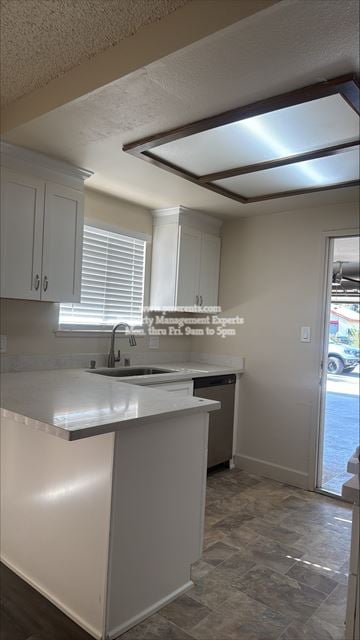 Modesto apartment for rent - A kitchen with white cabinets and a tiled floor.