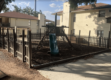 San Antonio apartment for rent - A playground with a green slide and a blue slide.
