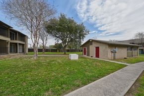 Pleasanton apartment for rent - our apartments are located in a neighborhood with a sidewalk and grass at Eagle View Apartments, Pleasanton, TX