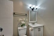 San Antonio apartment for rent - a small bathroom with a toilet and a sink and a mirror at The Crossings at Montrose Apartments, San Antonio, TX, 78223