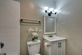 San Antonio apartment for rent - a small bathroom with a toilet and a sink and a mirror at The Crossings at Montrose Apartments, San Antonio, TX, 78223