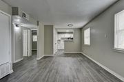 San Antonio apartment for rent - an empty living room and kitchen in a new home at The Crossings at Montrose Apartments, Texas, 78223
