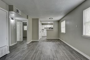 San Antonio apartment for rent - an empty living room and kitchen in a new home at The Crossings at Montrose Apartments, Texas, 78223