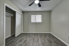 San Antonio apartment for rent - an empty bedroom with a closet and a ceiling fan at The Crossings at Montrose Apartments, San Antonio