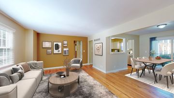 Overland Park apartment for rent - A living room with a grey couch and a coffee table.
