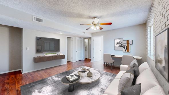 Kansas City apartment for rent - A living room with a white couch and a coffee table.