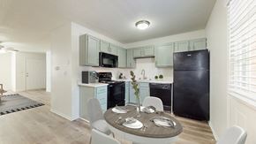 Olathe townhouse for rent - A kitchen with a table set for four.