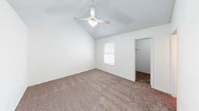 Belton townhouse for rent - an empty room with carpet and a ceiling fan