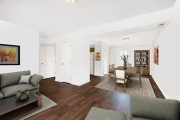 Gardner apartment for rent - A living room with a grey couch and a coffee table.