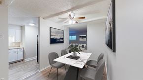Kansas City apartment for rent - A dining room with a table and chairs.