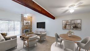 Lawrence townhouse for rent - A living room with a fireplace and a flat screen TV.