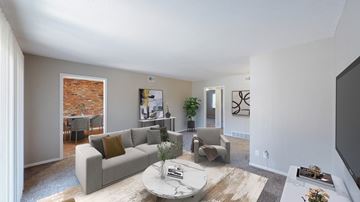 Kansas City apartment for rent - A living room with a grey couch and a coffee table.