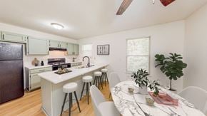 Kansas City apartment for rent - an open kitchen and dining area with a marble counter top