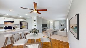 Kansas City apartment for rent - a living room with a kitchen and a ceiling fan