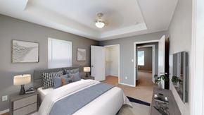 Kansas City apartment for rent - a bedroom with a large bed and a closet