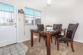 Bloomington apartment for rent - A dining room with a table and chairs.