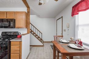 Bloomington apartment for rent - A dining room with a table set for two.